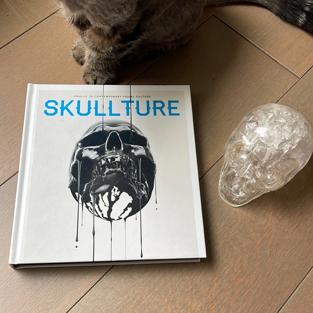 Skullture coffee table book and skull paperweight